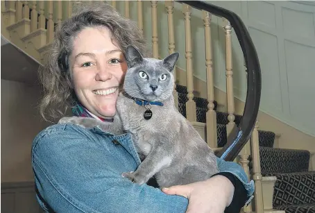  ??  ?? Old Government House custodian Emma Newborn became owner of Governor Grey, a burmese cat, two years ago.