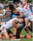  ?? Photo: Kevin Farmer ?? TACKLED: Gold Coast Titans prop Kevin Proctor is wrapped up by the Dragons defence.