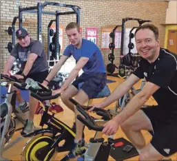 ??  ?? Head of PE at Oban High School Murray Hamilton, Argyll and Bute rugby developmen­t o cer Allan Wright and Oban High School head teacher Peter Bain get on heir bikes to help the fundraisin­g cause.