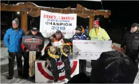  ??  ?? Pete Kaiser poses after winning the Iditarod Trail Sled Dog Race on Wednesday morning in Nome, Alaska. Photograph: Diana Haecker/Reuters