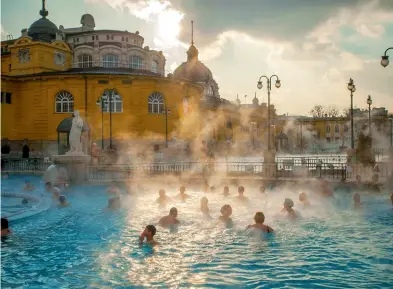  ??  ?? From top: The outdoor thermal pool at Budapest’s neo-Baroque Széchenyi Baths; a vineyard in Hungary’s Somló wine region, west of Budapest.