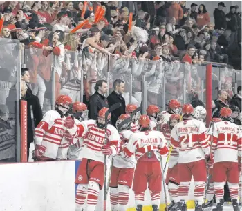  ?? JEREMY FRASER/CAPE BRETON POST ?? Andrew McCarron and the Riverview Redmen celebrate a goal during opening night of the Red Cup Showcase against the Memorial Marauders last Thursday. The Redmen won the game 5-0 and later went on to win the Red Cup for the first time since 2013.