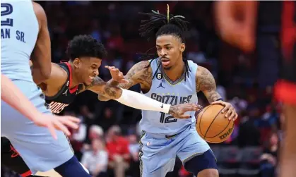  ?? Photograph: Troy Taormina/USA Today Sports ?? Memphis Grizzlies guard Ja Morant (12) controls the ball as Houston Rockets guard Jalen Green (4) defends during the first quarter of a game earlier this week.