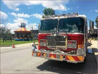  ?? KATHLEEN CAREY – DIGITAL FIRST MEDIA ?? A fire truck rolls down the street during Saturday’s celebratio­n of Marcus Hook’s 125th year as a borough.