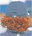  ?? N.Y. Post: Charles Wenzelberg (2) ?? OUT OF LOCK: Yankees outfielder Clint Frazier arrived at spring training in Tampa with a decidedly tamer look this year (right) than in 2017 (left).
