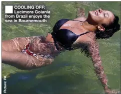  ??  ?? COOLING OFF: Lucimora Goiania from Brazil enjoys the sea in Bournemout­h