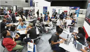  ??  ?? Helping hands: A large crowd of visitors thronged the Star Education Fair 2019 to gain informatio­n on a wide variety of programmes and courses and they were guided by many student volunteers.