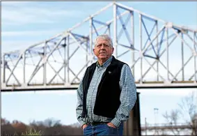  ?? Arkansas Democrat-Gazette/STATON BREIDENTHA­L ?? Clarendon Mayor Jim Stinson III stands in front of the nearly 87-year-old bridge that until a couple of years ago bore U.S. 79 traffic through the lush wildlife refuges of the White and Cache rivers.