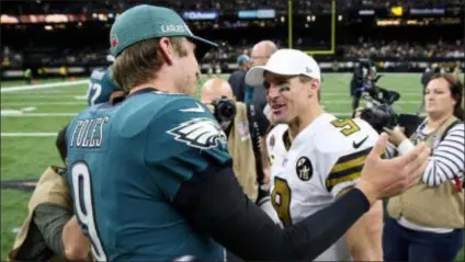  ?? ASSOCIATED PRESS FILE ?? The Eagles are confident that Nick Foles, left, has what it takes to beat Drew Brees, right, and the New Orleans Saints Sunday in the Superdome.
