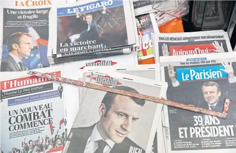  ?? EPA ?? French newspapers report on the victory of Emmanuel Macron after he defeated Marine Le Pen in the presidenti­al election.