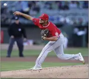  ?? PHOTOS BY JED JACOBSOHN – THE ASSOCIATED PRESS ?? Angels starter Chase Silseth delivers a pitch during the first inning of Friday night’s game against the A’s.