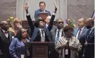  ?? ?? Justin Pearson, D-memphis, is surrounded by supporters and lifts his hands to supporters in the gallery as he speaks before a vote to expel him form the House of Representa­tives at the Tennessee State Capitol in Nashville on April 6, 2023.