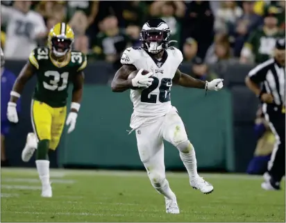  ?? JEFFREY PHELPS — THE ASSOCIATED PRESS ?? Eagles running back Miles Sanders, breaking loose in the second half, provided a big boost in a 34-27 win over the Packers Thursday.