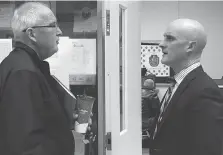  ?? SHARON HILL ?? Amherstbur­g police board chair Bob Rozankovic, left, chats with outgoing Coun. Jason Lavigne Monday night. Lavigne denies disclosing confidenti­al informatio­n to Rozankovic and was looking to “set the record straight” on Monday night.