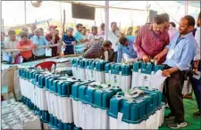  ?? PTI ?? Polling parties collect EVMs and other election material at a distributi­on centre ahead of Lok Sabha polls, in Dehradun, on Wednesday
