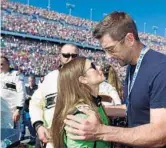  ?? JARED C. TILTON/GETTY IMAGES ?? Danica Patrick received words of encouragem­ent from boyfriend Aaron Rodgers of the Green Bay Packers before she drove in her final NASCAR race.