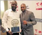  ?? Picture: FILE ?? ANOTHER AWARD: Ayanda Matiti is congratula­ted by boxing legend Roy Jones Jnr after winning yet another IBF award. This past weekend Matiti won the promoter of the year award at the IBF convention held in Italy
