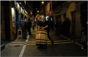  ?? (AP/Alvaro Barrientos) ?? A worker gets a bar ready to shut down Wednesday in Pamplona in northern Spain, where all bar and restaurant­s will be closing for 15 days. Spain became the first country in western Europe to report more than 1 million coronaviru­s cases.