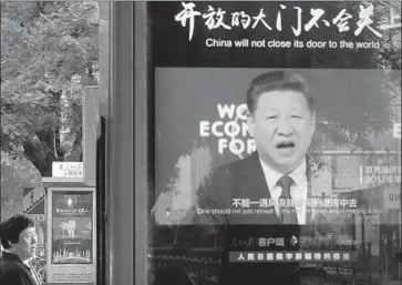  ?? Andy Wong Associated Press ?? THE CHINESE government can easily launch a propaganda campaign to encourage a boycott of American goods, one expert says. Above, President Xi Jinping appears on an electronic display in Beijing.