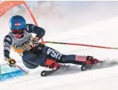  ?? TIZIANA FABI/AFP ?? Mikaela Shiffrin competes in the downhill event as part of the FIS Alpine World Ski Championsh­ips on Saturday in Cortina d’Ampezzo, Italian Alps.