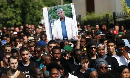  ?? Photograph: Thomas Samson/AFP ?? Marchers hold aloft a picture of Adama Traoré, sometimes referred to as ‘France’s George Floyd’, at a rally in 2016.
