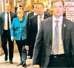  ??  ?? Merkel walks back to her hotel after going out for a walk and dinner shortly after arriving in Washington. —Reuters photo