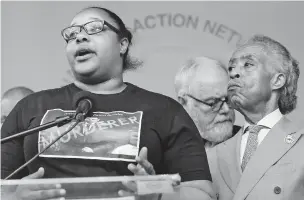  ?? BEBETO MATTHEWS/ASSOCIATED PRESS ?? Emerald Garner, left, the daughter of chokehold victim Eric Garner, joins the Rev. Al Sharpton, founder of the National Action Network, at a news conference Monday in New York.