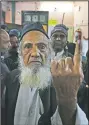  ?? (AP/Manish Swarup) ?? An elderly Muslim man shows the indelible ink mark on his finger after casting his vote Saturday at a polling station in the old quarters of New Delhi.