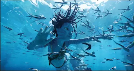  ?? ?? James Cameron’s “Avatar: The Way of Water” (Trinity Bliss as Tuk) displays politics that many consider as woke.