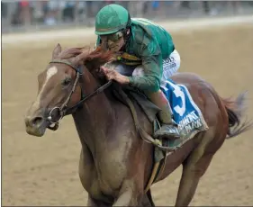  ?? ELSA LORIEUL/NYRA ?? Code of Honor with hall of fame jockey John Velazquez up broke from the back of the pack and was hand ridden to the Dwyer Stakes victory Saturday afternoon at Belmont Park.