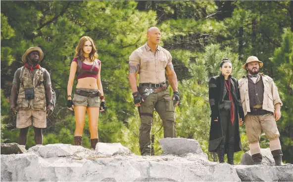  ?? COLUMBIA PICTURES ?? Actors Kevin Hart, left, Karen Gillan, Dwayne Johnson, Awkwafina and Jack Black star in Jake Kasdan’s amusing and fast-moving new movie Jumanji: The Next Level.