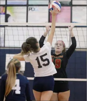  ?? GENE WALSH — DIGITAL FIRST MEDIA ?? Gwynedd Mercy’s Katie Denitz goes up to block St.Basil’s Morgan Schissler Monday.