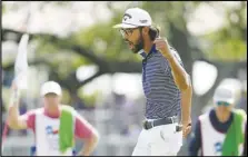  ?? Associated Press ?? Akshay Bhatia reacts to a birdie putt on the 18th hole during the final round of the Texas Open golf tournament, Sunday, in San Antonio. Bhatia defeated Denny McCarthy in a playoff.