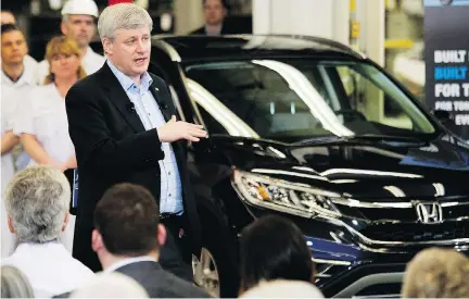  ??  NATHAN DENETTE/THE CANADIAN PRESS ?? Prime Minister Stephen Harper visits the Honda Canada manufactur­ing plant Monday in Alliston, Ont., where he praised his government’s new trade deal with Europe. Honda expects the deal will lead to the export of Canadian-made vehicles to Europe.