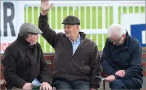 ?? Photo by Domnick Walsh ?? Bertie Murphy signalling apositive noteatthe Listowel Races on Monday, pictured with John Stokes and David Daly.