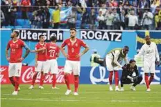  ?? AP/PTI ?? Switzerlan­d players react after the 1-0 defeat to Sweden in the round of 16 match in St. Petersburg on Tuesday.