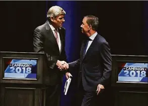  ?? Jessica Hill / Associated Press ?? Republican Bob Stefanowsk­i, left, shakes hands with Democrat Ned Lamont after a 2018 debate at UConn. The duo is on track for a rematch in November.