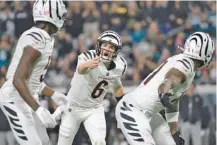  ?? AP PHOTO/PHELAN M. EBENHACK ?? Cincinnati Bengals quarterbac­k Jake Browning (6) gestures during the first half against the Jacksonvil­le Jaguars on Dec. 4 in Jacksonvil­le, Fla.