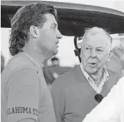  ?? [PHOTO BY CHRIS LANDSBERGE­R, THE OKLAHOMAN] ?? Boone Pickens talks with coach Mike Gundy during Oklahoma State’s Pro Day on March 15. Pickens announced Wednesday that he’ll attend OSU’s season opener Thursday.