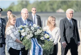  ??  ?? German President Frank-Walter Steinmeier, right, and Israeli President Reuven Rivlin, second left, during the ceremony to open the 1972 Munich Olympic massacre memorial.