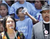  ?? ?? A young man sips some water as civil rights activist
Dolores Huerta, left, speaks in support a clean water measure before the legislatur­e, during a rally in Sacramento in June 2019. The California legislatur­e in 2019 approved $130million a year to make improvemen­ts in communitie­s where people can’t drink the water from their taps.