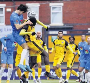  ?? Www.mphotograp­hic.co.uk ?? ●●Ash Palmer gets up above the Aldershot defence