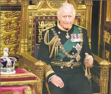  ?? AP ?? Prince Charles sits next to Queen Elizabeth’s crown as he took her place during the State Opening of Parliament at the Palace of Westminste­r in London on Tuesday.