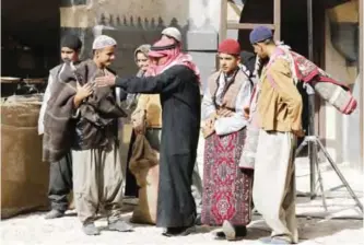  ??  ?? Syrian actors are seen on the filming set of television series ‘Tawq al-Banat’ in the village of Yaafur, some 20kilometr­es (12 miles) west of Damascus.— AFP photos