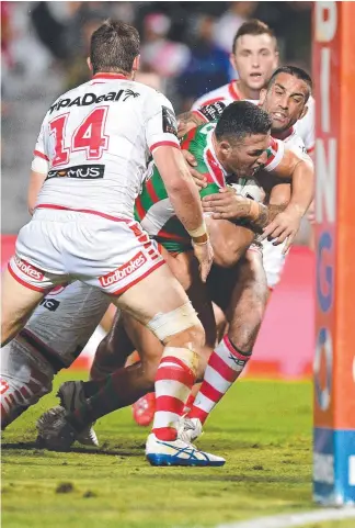  ?? Picture: AAP IMAGE ?? Big Sam Burgess pushes through the Dragons defence to score a try.