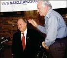  ?? AP ?? Jimmy Carter gives then-U.S. Sen. Max Cleland, D-Ga., a standing ovation during Cleland’s campaign rally in Plains, Georgia, in 2002.