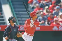  ?? JAE C. HONG/THE ASSOCIATED PRESS ?? The Angels’ Shohei Ohtani watches his two-run home run during Wednesday’s game against the Indians in Anaheim, Calif. It was his second homer in as many days.