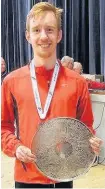  ??  ?? Trophy time Harriers’ top senior finisher Ryan Thomson