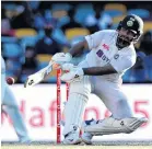  ?? PHOTO: GETTY IMAGES ?? Indian wicketkeep­erbatsman Rishabh Pant plays an unorthodox shot on day five of his team’s fourth test against Australia at The Gabba in Brisbane on Tuesday.