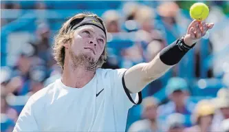  ?? JOHN MINCHILLO THE ASSOCIATED PRESS ?? Andrey Rublev of Russia serves to Roger Federer of Switzerlan­d during the quarterfin­als of the Western & Southern Open tennis tournament Thursday in Mason, Ohio. Rublev won in just over an hour.